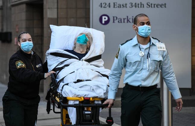 April 6, 2020, New York, New York, USA: Paramedics wheel a patient into NYU Langone Hospital in Manhattan, Monday, the start of what is expected to be the worst week of the Coronavirus pandemic. The coronavirus body count in New York state held steady Monday for the second consecutive day at about 600 deaths. New York USA - ZUMAl113 20200406_zap_l113_004 Copyright: xMiguelxJuarezxLugox
