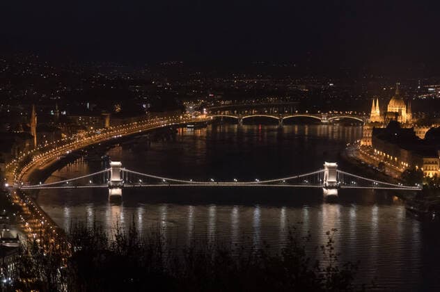 (200407) -- BUDAPEST, April 7, 2020 -- Chain Bridge is illuminated with white light as a show of appreciation for healthcare workers efforts to combat the COVID-19 pandemic in Budapest, Hungary, April 6, 2020. (Photo by Xinhua) HUNGARY-BUDAPEST-COVID-19-WHITE LIGHT ILLUMINATION AttilaxVolgyi 