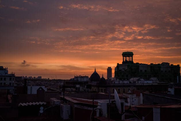 April 7, 2020, Barcelona, Catalonia, Spain: The sun rises over rooftops and domes In Barcelona city. After four-day fall, daily coronavirus deaths in Spain rise to 743. The total number of fatalities in the country now stands at 13,798, with 140,510 confirmed infections. Barcelona Spain - ZUMAb137 20200407_zap_b137_009 Copyright: xJordixBoixareux
