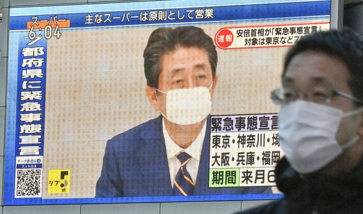 New coronavirus A large screen in Nagoya shows on April 7, 2020, Japanese Prime Minister Shinzo Abe declaring a state of emergency in Tokyo and other big cities in response to a surge in coronavirus infections. 