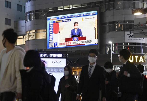 New coronavirus A large screen in Nagoya shows on April 7, 2020, Japanese Prime Minister Shinzo Abe declaring a state of emergency in Tokyo and other big cities in response to a recent surge in coronavirus infections. 
