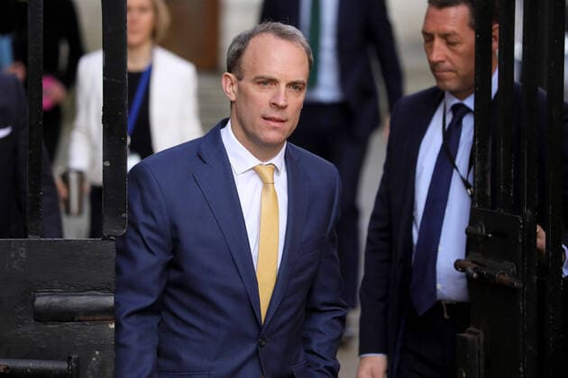 (200407) -- LONDON, April 7, 2020 (Xinhua) -- British Foreign Secretary Dominic Raab (C) arrives at 10 Downing street for the COVID-19 committee meeting in London, Britain, April 7, 2020. British Prime Minister Boris Johnson was taken to intensive care on Monday night after his coronavirus symptoms worsened, Downing Street said. Johnson has asked British Foreign Secretary Dominic Raab to deputize for him, a Downing Street spokesman said. (Photo by Tim Ireland Xinhua) BRITAIN-LONDON-COVID-19 