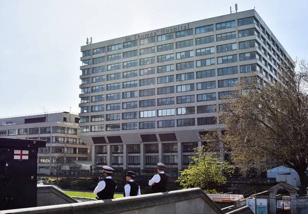 LONDON, UNITED KINGDOM - APRIL 7, 2020: Police officers stand guard outside St Thomas Hospital where British Prime Minister Boris Johnson is being treated for the novel coronavirus (COVID-19) infection. The prime minister was admitted to the hospital on 5 April and taken to intensive care on the next day. Ilya Dmitryachev TASS  TS0D4C08
