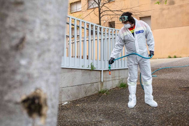 April 7, 2020, Girona, Spain: A civil protection agent dressed in a protective suit sprays disinfectants at the Centre Residencial Gerunda..During the Covid-19 crisis, the civil protection agents of Gerona carry out disinfection tasks in the residences for the elderly. Girona Spain - ZUMAs197 20200407_zaa_s197_046 Copyright: xMartixNavarrox