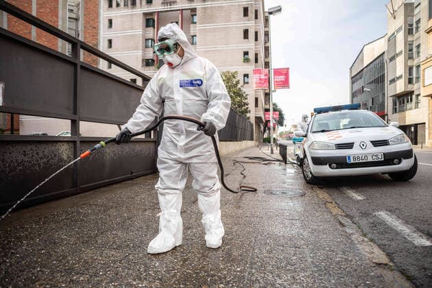 April 7, 2020, Girona, Spain: A civil protection agent dressed in a protective suit sprays disinfectants on the streets in front of a senior center...During the Covid-19 crisis, the civil protection agents of Gerona carry out disinfection tasks in the residences for the elderly. Girona Spain - ZUMAs197 20200407_zaa_s197_048 Copyright: xMartixNavarrox