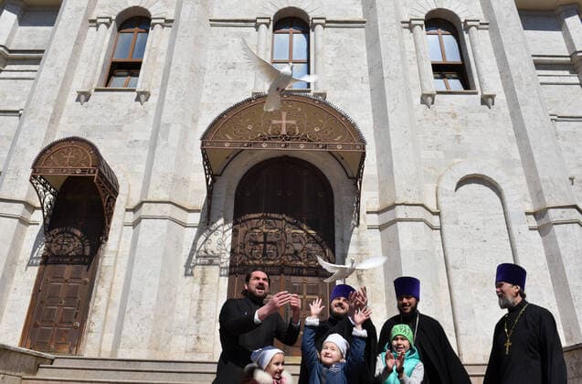 STAVROPOL TERRITORY, RUSSIA - APRIL 7, 2020: Russian Orthodox priests release doves at the entrance to the Cathedral of Christ the Saviour Healing An Infirm Man At The Pool of Bethesda, on the feast day of the Annunciation, in the city of Pyatigorsk. Anton Podgaiko TASS  TS0D4B19