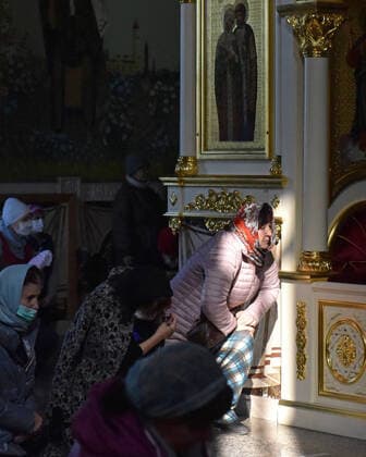 STAVROPOL TERRITORY, RUSSIA - APRIL 7, 2020: Russian Orthodox believers kneel during a service in the Cathedral of Christ the Saviour Healing An Infirm Man At The Pool of Bethesda, on the feast day of the Annunciation, in the city of Pyatigorsk. Anton Podgaiko TASS  TS0D4B7D