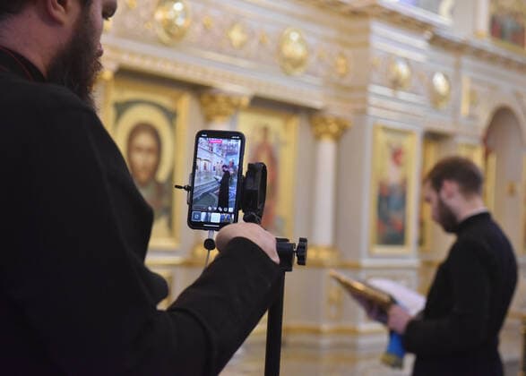 STAVROPOL TERRITORY, RUSSIA - APRIL 7, 2020: A Russian Orthodox clergyman live streams a service in the Cathedral of Christ the Saviour Healing An Infirm Man At The Pool of Bethesda, on the feast day of the Annunciation, in the city of Pyatigorsk, during the pandemic of the novel coronavirus (COVID-19). Anton Podgaiko TASS  TS0D4B88
