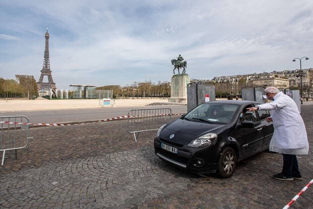 (200407) -- PARIS, April 7, 2020 (Xinhua) -- A biologist from Eylau Unilabs Analysis Laboratories works at a COVID-19 drive-through testing station near Champs de Mars in Paris, France, April 7, 2020. (Photo by Aurelien Morissard Xinhua) FRANCE-PARIS-COVID-19-DRIVE THROUGH TEST 