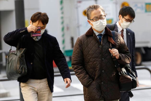 April 7, 2020, Tokyo, Japan: Japanese salarymen wearing face masks are seen on the streets of downtown Tokyo. Japanese Prime Minister Shinzo Abe declared a state of emergency for Tokyo and six other prefectures (Kanagawa, Saitama, Chiba, Osaka, Hyogo and Fukuoka) responding to the coronavirus pandemic. Tokyo Japan - ZUMAm191 20200407_zap_m191_020 Copyright: xRodrigoxReyesxMarinx