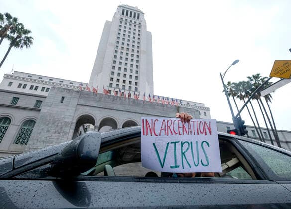 April 7, 2020, Los Angeles, California, U.S: Amid fears of the coronavirus pandemic, protesters drive their cars and trucks in a noisy procession in otherwise mostly silent, empty streets in downtown Los Angeles, Tuesday, April 7, 2020. The demonstration is designed to persuade county leaders to release the incarcerated from detention centers into homes where they can be monitored away from jails that have become breeding grounds for the virus. Los Angeles U.S. - ZUMAc68_ 20200407_zaf_c68_011 Copyright: xRingoxChiux