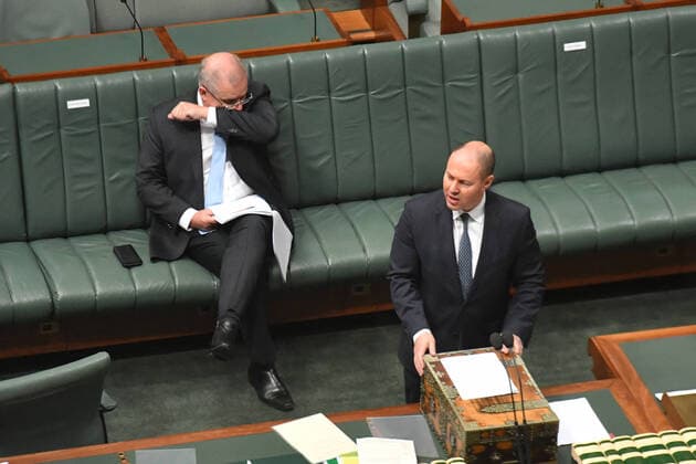 CORONAVIRUS LEGISLATION PARLIAMENT, Prime Minister Scott Morrison coughs into his elbow as Treasurer Josh Frydenberg speaks during a parliamentary sitting under rules of social distancing in the House of Representatives at Parliament House in Canberra, Wednesday, April 8, 2020. ( NO ARCHIVING, EDITORIAL USE ONLY, NO USE IN BOOKS WITHOUT CONSENT Canberra ACT AUSTRALIA  Copyright: xMICKxTSIKASx 20200408001462295241