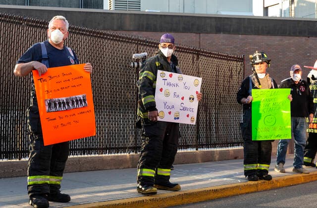NY: Nassau County first responders salute medics Nassau County first responders line up to salute heroes from front lines of COVID-19 pandemic at North Shore University Hospital Manhasset New York United States Copyright: LevxRadin