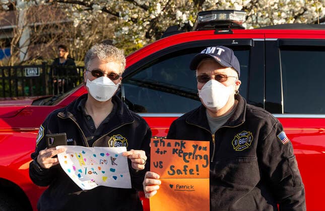 NY: Nassau County first responders salute medics Nassau County first responders line up to salute heroes from front lines of COVID-19 pandemic at North Shore University Hospital Manhasset New York United States Copyright: LevxRadin