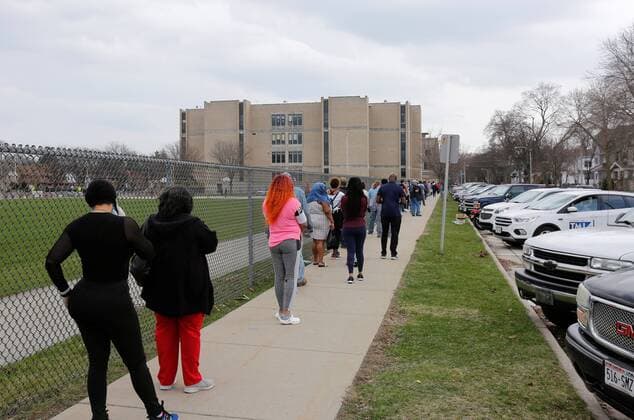 April 7, 2020, Milwaukee, Wisconsin, U.S: Milwaukee County residents line up to vote Tuesday April, 7, 2020 during the COVID-19 pandemic. Wisconsin Governor Tony Evers sought to postpone the elections because of the (coronavirus) COVID-19 pandemic, and was overruled by the Wisconsin Supreme Court to have the voting proceed as scheduled. Milwaukee U.S. - ZUMAr148 20200407_zap_r148_100 Copyright: xPatxA.xRobinsonx