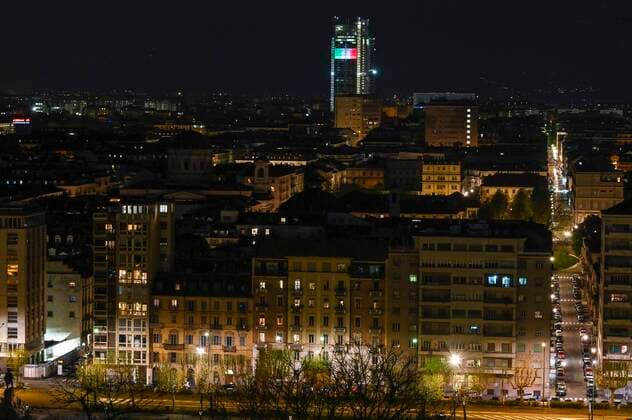 Turin. Intesa SanPaolo and Mole Antonelliana skyscraper with the Italian flag during the lockdown for Covid19 in the photo: Mole Antonelliana  Copyright: xRiccardoxGiordanox xIPAx xFotosickix