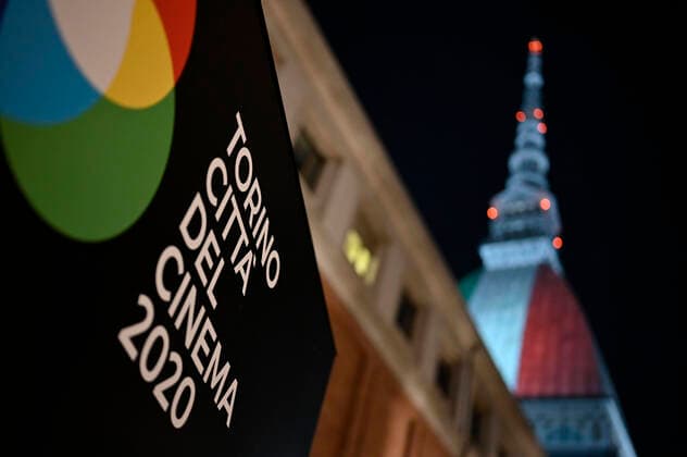 Turin. Intesa SanPaolo and Mole Antonelliana skyscraper with the Italian flag during the lockdown for Covid19 in the photo: Mole Antonelliana  Copyright: xRiccardoxGiordanox xIPAx xFotosickix