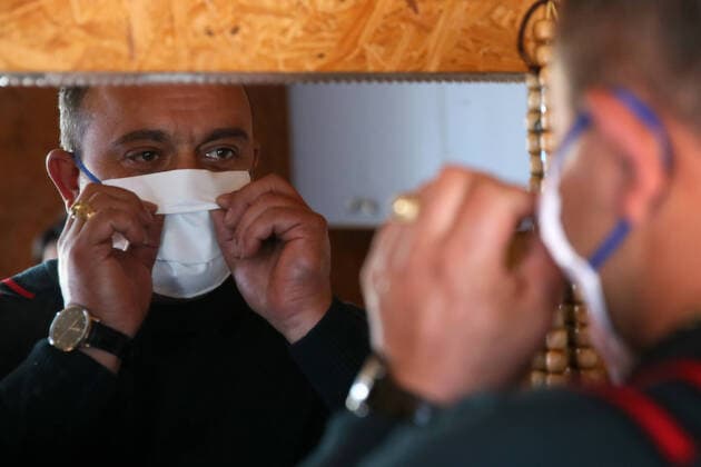 SOCHI, RUSSIA - APRIL 8, 2020: Georgy Barsegyan in a face mask. The Barsegyans receive materials from the Sochi city hall, sew face masks and give them to volunteers and healthcare workers attending patients under quarantine. Dmitry Feoktistov TASS  TS0D4D9B
