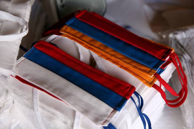 SOCHI, RUSSIA - APRIL 8, 2020: Face masks with the Russian and the Armenian national flags sewn by the Barsegyan family. The Barsegyans receive materials from the Sochi city hall, sew face masks and give them to volunteers and healthcare workers attending patients under quarantine. Dmitry Feoktistov TASS  TS0D4DAA