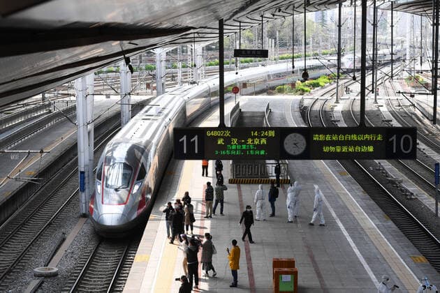 (200408) -- BEIJING, April 8, 2020 -- The G4802 high-speed train pulls in at the Beijing West Railway Station in Beijing, capital of China, April 8, 2020. G4802, the first high-speed train departing from Wuhan since the city resumed outbound travel, arrived at Beijing West Railway Station on Wednesday. Wuhan, the megacity in central China, lifted outbound travel restrictions from Wednesday after almost 11 weeks of lockdown to stem the spread of COVID-19. ) CHINA-BEIJING-TRAIN FROM WUHAN-ARRIVAL (CN) JuxHuanzong 