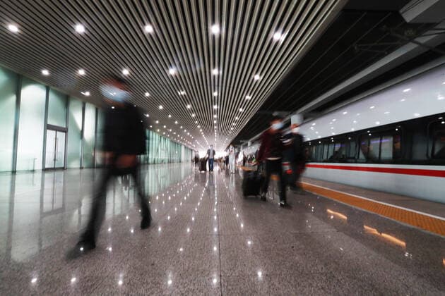 (200408) -- GUANGZHOU, April 8, 2020 -- Passengers get off the train G1005 and leave the Guangzhou South Railway Station in Guangzhou, south China s Guangdong Province, April 8, 2020. G1005, the first train that departed from Wuhan to Guangdong Province since Wuhan lifted outbound travel restrictions arrived at Guangzhou South Railway Station on Wednesday. The train was destined for Shenzhen. ) CHINA-GUANGZHOU-TRAIN FROM WUHAN-ARRIVAL (CN) LuxYe 