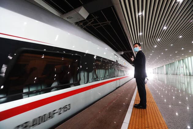 (200408) -- GUANGZHOU, April 8, 2020 -- The train G1005 leaves for Shenzhen North Station after a stop at Guangzhou South Railway Station in Guangzhou, south China s Guangdong Province, April 8, 2020. G1005, the first train that departed from Wuhan to Guangdong Province since Wuhan lifted outbound travel restrictions arrived at Guangzhou South Railway Station on Wednesday. The train was destined for Shenzhen. ) CHINA-GUANGZHOU-TRAIN FROM WUHAN-ARRIVAL (CN) LuxYe 