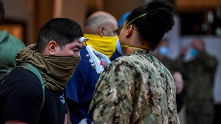 April 7, 2020, Apra Harbor, Guam, United States of America: U.S. Navy sailors assigned to the aircraft carrier USS Theodore Roosevelt are screened before being relocated to local hotels in an effort to contain the outbreak of COVID-19, coronavirus April 7, 2020 in Apra Harbor, Apra Harbor United States of America - ZUMAp138 20200407_zaa_p138_023 Copyright: xJulioxRivera U.S.xNavyx