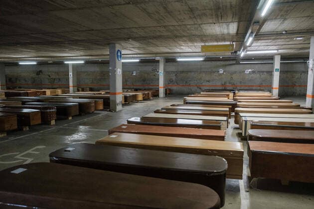 April 8, 2020, Barcelona, Spain: Coffins full of dead bodies from Coronavirus (Covid-19) in the Collserola mortuary parking lot. This space has been converted into a morgue due to the increase in deaths of Covid19...Coronavirus outbreak in Spain has already killed 14,659 people. The large number of deaths has forced Eurocoffin, the main coffin factory in Catalonia, to triple its production, from 50 to 150 coffins per day. Isolation and quarantine prevent family members from gettting infected or infect others. In Spain today, the pandemic leaves numbers of 146,690 infected and 48,021 recovered. Barcelona Spain - ZUMAs197 20200408_zaa_s197_155 Copyright: xPabloxMiranzox