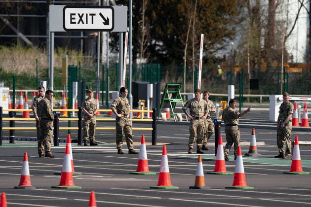 (200408) -- MANCHESTER (BRITAIN), April 8, 2020 -- Soldiers are seen at a drive-through COVID-19 testing facility in Manchester, Britain, on April 8, 2020. As of Wednesday morning, the number of confirmed COVID-19 cases in Britain hit 60,733, up 5,492 in the past 24 hours, said the Department of Health and Social Care. (Photo by Xinhua) BRITAIN-MANCHESTER-COVID-19-DRIVE THROUGH TEST JonxSuper
