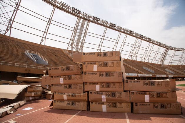 Boxes of prefabricated Refugee Housing Units (RHUs) are stored at the General Seyni Kountche stadium which was requisitioned by the Government of Niger to set up an isolation site in Niamey as part of the Covid-19 preparedness and response plan. The Office of the United Nations High Commissioner for Refugees (UNHCR) is supporting the establishment of isolation sites in Niamey and the region through the installation of Refugee Housing Units (RHUs) equipped with beds and air conditioning. UNHCR will provide a total of 350 equipped RHUs throughout the country for a total of 700 places, including 100 places for the Nigerian capital.  NicolasxRemenex xLexPictorium LePictorium_0227395