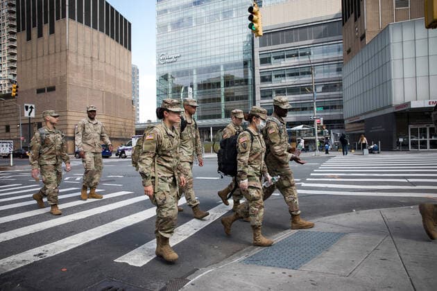 (200409) -- NEW YORK, April 9, 2020 (Xinhua) -- Soldiers cross a street in front of NYU Langone Medical Center during the coronavirus pandemic in New York, the United States, April 8, 2020. The number of COVID-19 cases in the United States reached 401,166 as of 12:20 local time on Wednesday (1620 GMT), according to the Center for Systems Science and Engineering (CSSE) at Johns Hopkins University. A total of 12,936 deaths were reported in the nation, according to the CSSE. (Photo by Michael Nagle Xinhua) U.S.-NEW YORK-COVID-19 