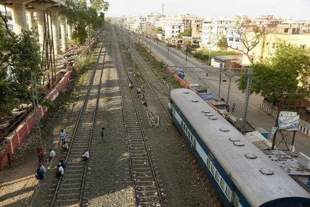 PATNA, INDIA APRIL 7: People rest by the railway tracks on day fourteen of the 21 day nationwide lockdown to curb the spread of coronavirus, at Pataliputra Junction, on April 7, 2020 in Patna, India. (Photo by Santosh Kumar Hindustan Times ) India Goes Into 21 Day Lockdown Due To Coronavirus COVID 19