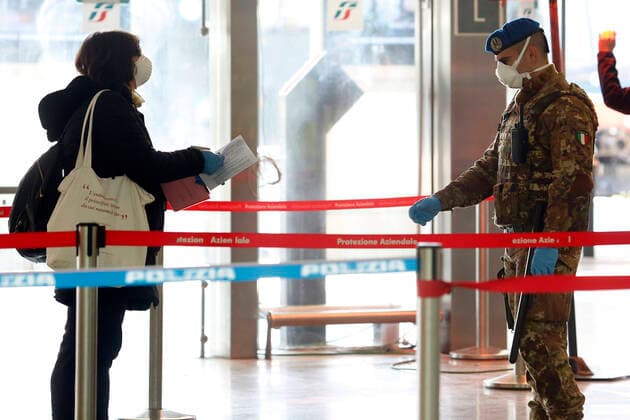 People undergoing documents control before entering the trains area Rome April 9th 2020. Termini train station. Due to the coronavirus emergency, bodyscanner were introduced at the mayor train stations. Since this morning, the Red Cross together with the volunteers of the Order of Doctors, will take the temperature with a body scanner on passenger arriving at the train stations. Photo Samantha Zucchi Insidefoto SamanthaxZucchi