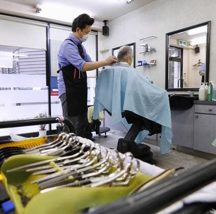 New coronavirus Photo taken April 9, 2020, shows a barber shop in Tokyo. A state of emergency is in place in Tokyo, Osaka and five other big cities in Japan amid a surge in coronavirus infections. 