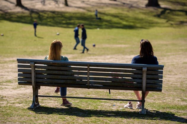 April 9, 2020, Berlin, Berlin, Germany: Two women sit at a safe distance on a park bench in a public park in Berlin. German Federal Government and the heads of government of the federal states adopted guidelines for further restricting social contacts in the public sector in view of the corona epidemic in Germany. Currently, meetings of more than two people are not allowed. As far as possible, a minimum distance of 1.5 meters must be maintained. Violations are punishable by a fine. Berlin Germany - ZUMAs172 20200409_zap_s172_001 Copyright: xJanxScheunertx