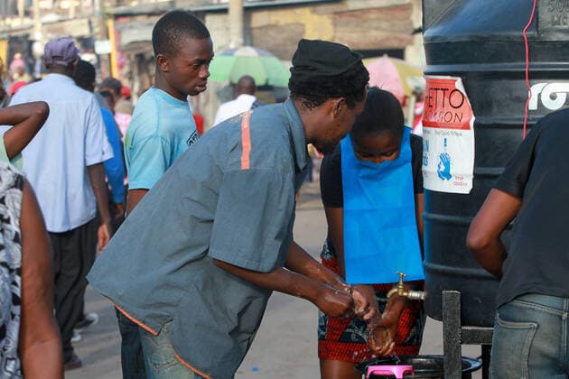 April 8, 2020, Nairobi, Kenya: Kenyans wash their hands with soap and water at a roadside after Ghetto Foundation distributed water tanks and soap..These items have been on demand after the Government directive on wearing face masks while in public places. On Monday, April 6, Kenyan President Uhuru Kenyatta announced a 21-day cessation of movement in and out of Nairobi and the counties of Kilifi, Kwale, and Mombasa due to the spread of COVID-19 in these regions. This followed a night curfew (7pm to 5am) that had been imposed just days before. Nairobi Kenya - ZUMAs197 20200408_zaa_s197_182 Copyright: xBonifacexMuthonix