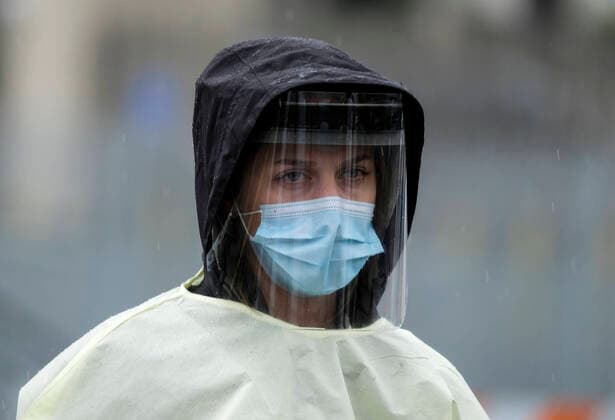 April 9, 2020, Los Angeles, California, U.S: A medical staff wearing a mask and protective face shield gives waits during a drive-through COVID-19 testing in a parking lot of the Rose Bowl in Pasadena, California on Thursday, April 9, 2020. Los Angeles U.S. - ZUMAc68_ 20200409_zaf_c68_002 Copyright: xRingoxChiux