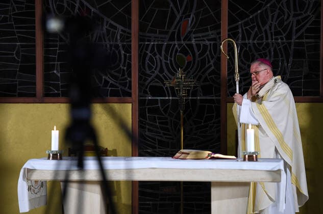 HOLY THURSDAY MASS COVID-19, Brisbane s Catholic archbishop Mark Coleridge is seen during a Holy Thursday mass, which is being broadcasted online, in an empty chapel at St Vincent s Private Hospital in Brisbane, Thursday, April 9, 2020. The hospital has made preparations to take in coronavirus victims if needed. ( NO ARCHIVING, EDITORIAL USE ONLY, NO USE IN BOOKS WITHOUT CONSENT BRISBANE QLD AUSTRALIA  Copyright: xDANxPELEDx 20200409001462634348