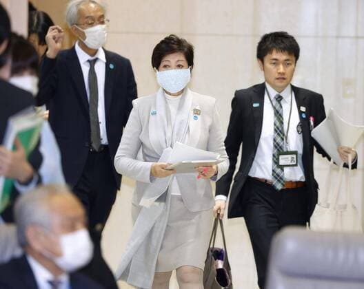 Tokyo s state of emergency business closure requests Tokyo Gov. Yuriko Koike (C) heads to a meeting of the metropolitan government s coronavirus task force in Tokyo on April 10, 2020, ahead of announcing the specifics of business suspensions that her administration will request under the state of emergency issued to help contain the capital s coronavirus outbreak. 