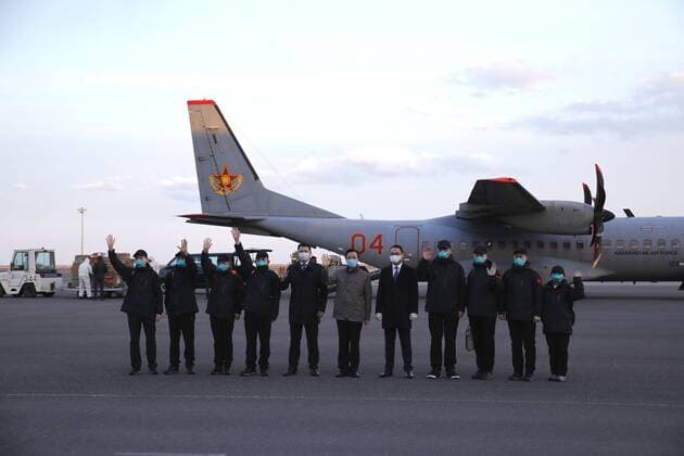 (200410) -- NUR-SULTAN, April 10, 2020 (Xinhua) -- Chinese medical team members arrive at the Nursultan Nazarbayev International Airport, Nur-Sultan, Kazakhstan, April 9, 2020. A Chinese medical team arrived in the Kazakh capital Nur-Sultan on Thursday to assist Kazakhstan s ongoing efforts in fight against COVID-19. The 10-member team also brought medical assistance including 4,800 N95 respirators, 49,600 disposable surgical masks, 2,000 protection suits, 2 ventilators and other medicines. (Photo by Kalizhan Ospanov Xinhua) KAZAKHSTAN-NUR-SULTAN-CHINESE MEDICAL TEAM-ARRIVAL