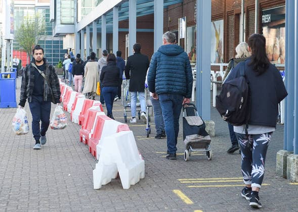 . 10 04 2020. London, United Kingdom. Coronavirus crisis. Early shoppers queue outside Tesco Extra at Surrey Quays Shopping Centre this morning. The coronavirus lockdown continues and shoppers have been warned that under trading laws, larger stores (over 280 square metres), must close on Easter Sunday, so they are likely to wait long queues during the bank holiday.  xGustavoxValientex xi-Imagesx IIM-21008-0021
