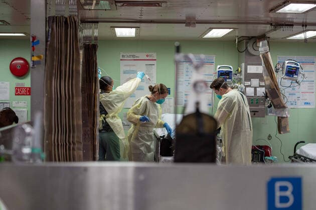 Los Angeles LOS ANGELES, USA -- 29 Mar 2020 -- US Navy medical personnel assigned to the hospital ship USNS Mercy (T-AH 19) treat the first patient from Los Angeles medical facilities, March 29, 2020. USNS Mercy deployed in support of the nation s COVID-19 response efforts, and will serve as a referral hospital for non-COVID-19 patients currently admitted to shore-based hospitals. This allows shore base hospitals to focus their efforts on COVID-19 cases. One of the Department of Defense s missions is Defense Support of Civil Authorities. DoD is supporting the Federal Emergency Management Agency, the lead federal agency, as well as state, local and public health authorities in helping protect the health and safety of the American people