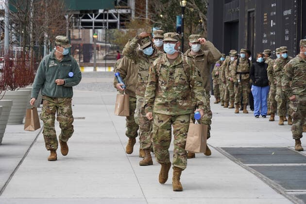 April 10, 2020, New York, New York, USA: Military and health care workers line up for lunch at the World Central Kitchen community kitchen, operated by Chef Jose Andres and Chefs for America, .The Javits Center,NYC.April 10, 2020.Photos by Sonia Moskowitz. New York USA - ZUMAm334 20200410_zep_m334_008 Copyright: xSoniaxMoskowitzxGordonx