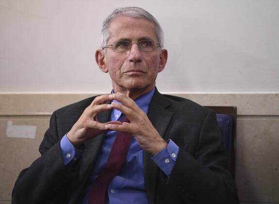 Dr. Anthony Fauci, director of the National Institute of Allergy and Infectious Diseases, listens during a Coronavirus briefing at the White House on Friday, April 10, 2020, in Washington, DC. With the U.S. death toll from the coronavirus pandemic expected to peak over the weekend, most of the country will be firmly under stay-at-home orders on Easter Sunday.  WAS202041050541 KEVINxDIETSCH