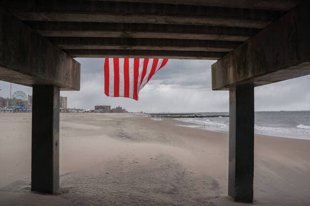 April 10, 2020, New York, NY, USA: An American flag blows in the wind off a pier in the Coney Island section of the Borough of Brooklyn on April 10, 2020 in New York. New York USA - ZUMAb148 20200410_zap_b148_101 Copyright: xBryanxSmithx