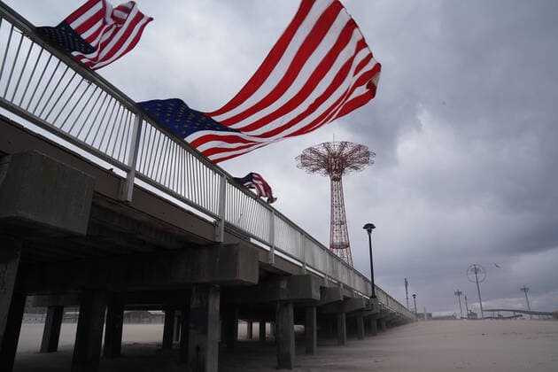 April 10, 2020, New York, NY, USA: American flags blowing in the wind off a pier in the Coney Island section of the Borough of Brooklyn on April 10, 2020 in New York. New York USA - ZUMAb148 20200410_zap_b148_110 Copyright: xBryanxSmithx