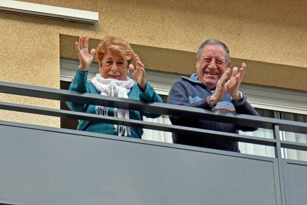 April 10, 2020, Vendrell, Spain: A couple applaud from the terrace of their house to show gratitude to the Covid-19 fighters..In the third fourth of confinement decreed by the Government of Spain since March 16, citizens from all over Spain continue to come out onto their terraces and applaud to show their gratitude to all people, such as health workers, police, firefighters, supermarket staff, truckers and cleaning staff for their great work in the fight for the Covid-19 health crisis. Vendrell Spain - ZUMAs197 20200410_zaa_s197_080 Copyright: xRamonxCostax