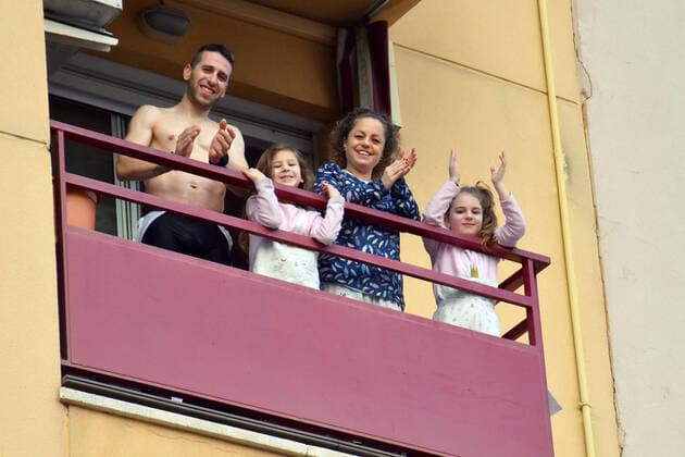 April 10, 2020, Vendrell, Spain: A family applaud from the terrace of their house to show gratitude to the Covid-19 fighters..In the third fourth of confinement decreed by the Government of Spain since March 16, citizens from all over Spain continue to come out onto their terraces and applaud to show their gratitude to all people, such as health workers, police, firefighters, supermarket staff, truckers and cleaning staff for their great work in the fight for the Covid-19 health crisis. Vendrell Spain - ZUMAs197 20200410_zaa_s197_084 Copyright: xRamonxCostax