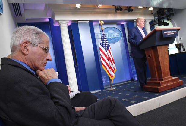 April 10, 2020, Washington, District of Columbia, USA: Director of the National Institute of Allergy and Infectious Diseases at the National Institutes of Health Dr. ANTHONY FAUCI, listens as United States President DONALD J. TRUMP speaks at a Coronavirus briefing at the White House. With the U.S. death toll from the coronavirus pandemic expected to peak over the weekend, most of the country will be firmly under stay-at-home orders on Easter Sunday. Washington USA - ZUMAs152 20200410_zaa_s152_024 Copyright: xKevinxDietschx