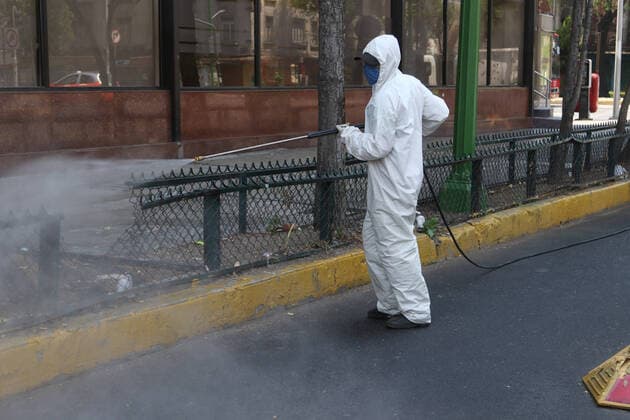 Mexico: Coronavirus prevention Health worker wears protective gear while spraying disinfectant solution on the ground outside the Buenavista train station as a measure security to combat the spread of the SARS COV-2 which causes the disease COVID-19. For editorial use only. Please contact your Local office representative for commercial use. **Mandatory Credit** Mexico City Mexico Copyright: IsmaelxRosas